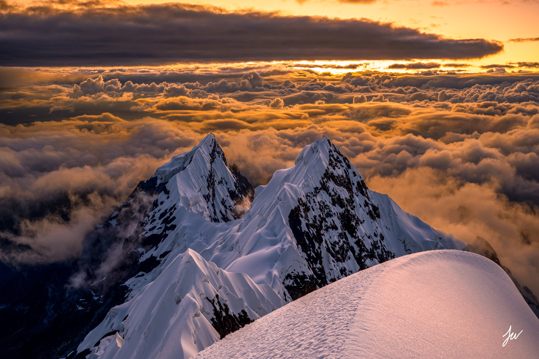 A hiker overlooking a valley in the Andes Mountains